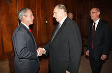 Monson, accompanied by Henry B. Eyring, shakes hands with U.S. President George W. Bush on May 29, 2008, in the Church Administration Building in Salt Lake City, Utah. President Bush meets with First Presidency of LDS church May 2008.jpg