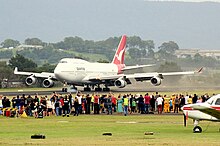 Boeing 747-438, City of Canberra, landing at the Shellharbour Airport for delivery to HARS. Qantas (VH-OJA) Boeing 747-438 makes its final ever landing at Illawarra Regional Airport.jpg