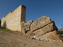 Restored (left) versus unrestored (right) section of pise wall near Bab Guissa, in Fes el-Bali Restored and unrestored wall of Fez.jpg