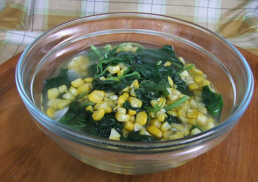 Sayur bening bayam, spinach and corn in clear soup.