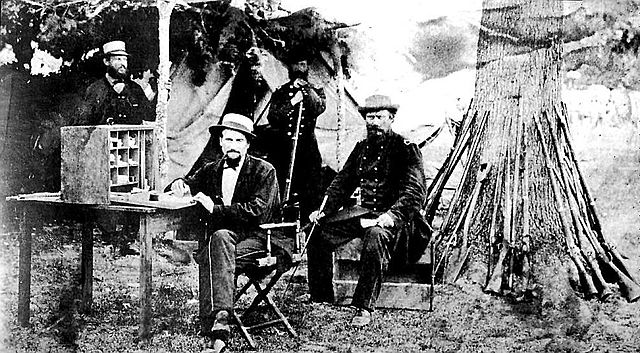 Group of 6th U.S. Cavalry officers in camp at Snickers Gap, Va., in 1862, standing, left to right, 2nd Lt. Thos. W. Simson, 1st Lt. Albert Coats. Sitt