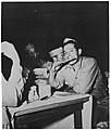 Soldier eating matzo, circa 1945 (5162253286).jpg