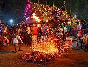 Theyyam entering into fire.jpg