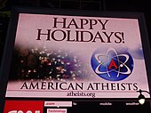 American Atheists billboard in New York 2013. Times Square after dark atheist.jpg