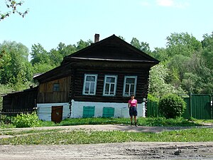 Thawed permafrost under this house caused it to settle unevenly—Tomsk, Siberia, Russia.