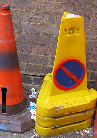 Traffic cone on the right is used to indicate that no parking is allowed (UK)