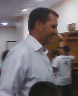 A picture of Ty Detmer wearing a button down.