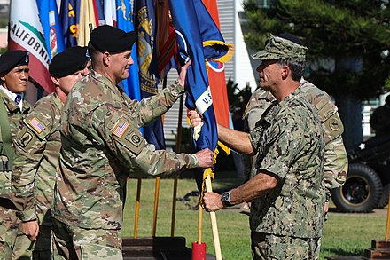 Newly promoted General Flynn receives the command colors of USARPAC from Admiral John C. Aquilino as he assumes command on June 4, 2021.