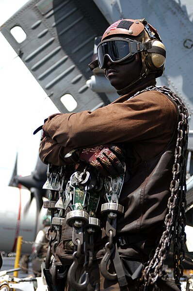 File:US Navy 030404-N-1159M-038 A Plane Captain stands by with tie down chains during an aircraft's recovery (landing) aboard USS Abraham Lincoln (CVN 72).jpg