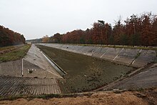 Slow "artificial" filtration (a variation of bank filtration) into the ground at the Water purification plant Karany, Czech Republic Vsakovaci nadrze umele infiltrace v UV Karany.jpg