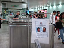 Wanted posters were visible everywhere in Singapore after his escape, such as this one at Somerset MRT station. WantedPosterMasSomerset.JPG