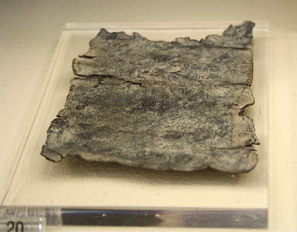 Ancient Greek curse tablet, text written onto a lead sheet, 4th century BC, Kerameikos Archaeological Museum, Athens.