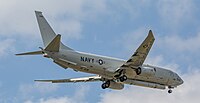 A Boeing P-8 Poseidon, tail number 168996, on final approach at Kadena Air Base in Okinawa, Japan. It has an AN/APS-154 Advanced Airborne Sensor (AAS) mounted underneath it.