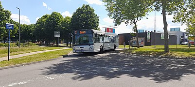 Heuliez GX 327 n°115 sur la ligne Z dans la zone commerciale de Buchelay