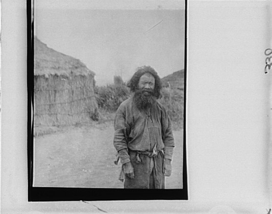 File:Ainu man standing outside LOC agc.7a10188.tif