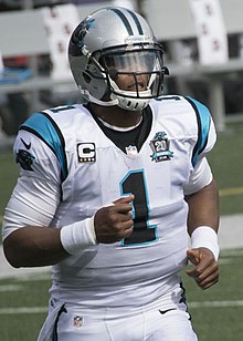 Cam Newton currently holds the record for the most career rushing attempts and touchdowns by a quarterback Cam Newton 2014.jpg