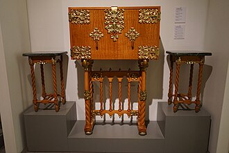 Coffer and small tables from Casa Trinxet made in Ceylon satinwood with marquetry. By Josep Puig i Cadafalch ca. 1906. On display at Museu del Modernisme Catala [ca], Barcelona Coffer and small tables from Casa Trinxet.JPG