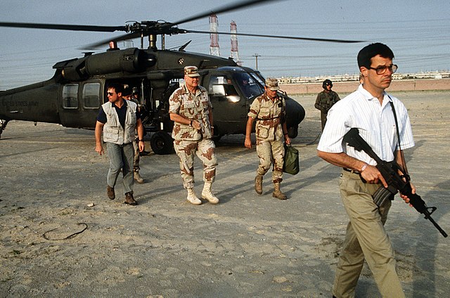 Delta Force bodyguards in civilian clothing providing close protection to General Norman Schwarzkopf during the Gulf War, 1991