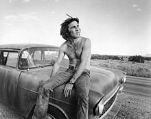 Dennis Wilson while filming Two-Lane Blacktop in 1970. His songs were left off Surf's Up to preserve harmony within the group. Dennis Wilson 1971.jpg
