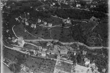 Aerial view from 300 m by Walter Mittelholzer (1919) ETH-BIB-Castangola, Ruvigliana v. S. aus 300 m-Inlandfluge-LBS MH01-001949.tif