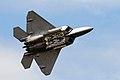 An F-22 Raptor shows the crowd how it remains stealthy while carrying weapons in flight by cycling it's weapons bay doors during the 50th Anniversary Naval Air Station Oceana Air Show.