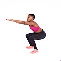 Fitness-woman-doing-air-squats-white-background.jpg