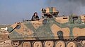 Un rebel sirian ce opereaza un blindat turc ACV-15