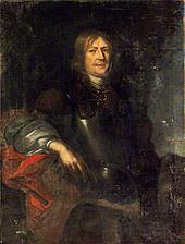 Oil painting of a middle-aged white man with long hair and a thin moustache, dressed in a cuirass with an undergarment with large, puffy sleeves. His body is turned slightly to the right, his face with a slight smile turned towards the viewer.