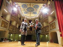 Johanna Beisteiner (left) receiving the Premio Teatro della Concordia 2016 from Edoardo Brenci (President of the Societa del Teatro della Concordia, right). Johanna Beisteiner Premio Teatro della Concordia 2016.jpg