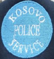 First cap badge of the Kosovo Police Service[19]