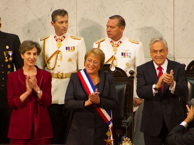 Both Michelle Bachelet (center) and Sebastián Piñera (right) were elected for two non-consecutive terms.