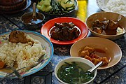 A traditional meal featuring several Burmese curries