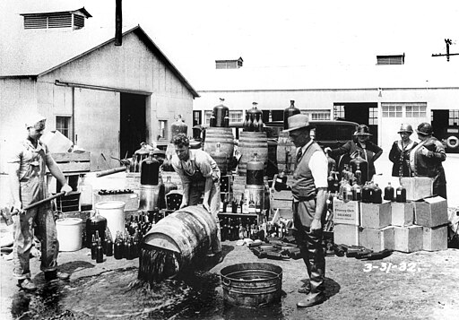Orange County Sheriff's deputies dumping illegal booze, Santa Ana, 3-31-1932