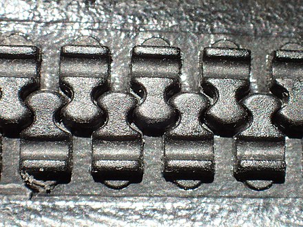 Watertight and airtight dry suit zipper made by TIZIP, Germany: Detail of closed teeth showing interlock above and (not visible) below the seal edge.
