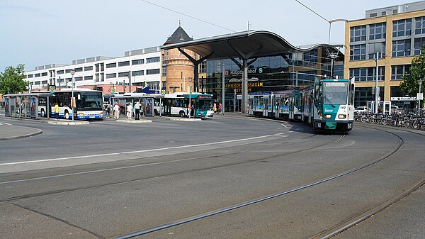 Station forecourt south of the tracks with bus and tram stop and water tower