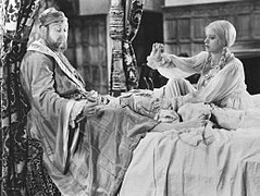 Com Charles Laughton em "The Private Life of Henry VIII" (1933).