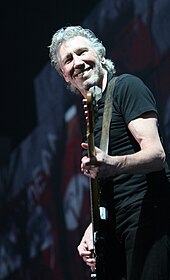 Roger Waters playing bass and singing