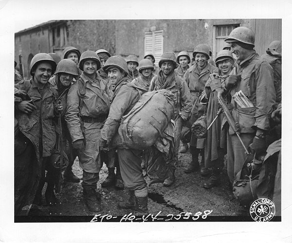 Infantrymen of 2nd Battalion, 30th Infantry Regiment depicted near Bult, France. 11 November 1944.