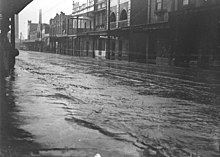 A flooded street in Alexandria after a rainstorm (September 1934) SLNSW 42421 A flooded street in Alexandria South Sydney.jpg