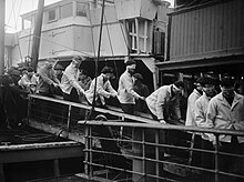 Blindfolded Scharnhorst survivors come ashore at Scapa Flow on 2 January 1944 Scharnhorst survivors A 021202.jpg