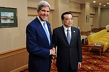 U.S. Secretary of State John Kerry speaks with Chinese Premier Li Keqiang, 9 October 2013. Secretary Kerry and Chinese Premier Li Shake Hands Before Their Meeting (10170270646).jpg