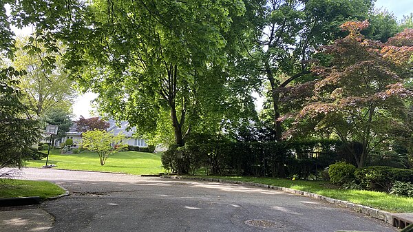 The former site of the Roslyn–Flower Hill Elementary School, as seen from Center Drive in 2020. After the school closed, the land was redeveloped as a