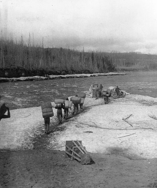 Portaging along the Slave River in 1900