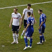 Tottenham defeated Chelsea 5–3 in the Premier League on 1 January 2015. Pictured are Tottenham's Harry Kane and Federico Fazio, with Chelsea's John Terry and Branislav Ivanović