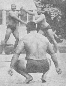 Here are some bros wrestling on a frozen river in 1910 