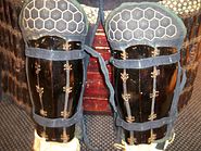 Antique Japanese (samurai) Edo period suneate. Armored shin guards made from iron plates attached to cloth backing. The knee area has small hexagon armor plates kikko sewn inside the backing.