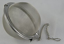 A mesh tea infuser ball Tea ball.jpg