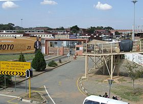 Entrance to the Chris Hani Baragwanath Hospital in 2007. Construction work referred to on the yellow notice has been completed and the entrance is once again open. The Chris Hani Baragwanath Hospital, Soweto.jpg