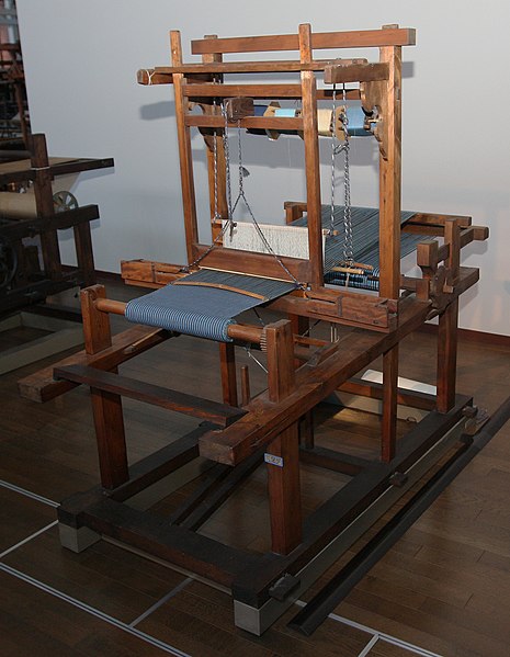 Narrow tanmono loom with an obvious shuttle race on a top-mounted beater bar. Late 1800s Japan.