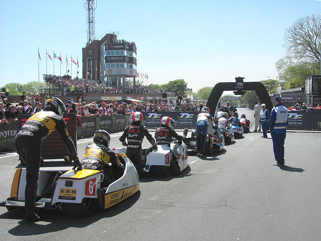 Sidecar TT race competitors line up to start the race